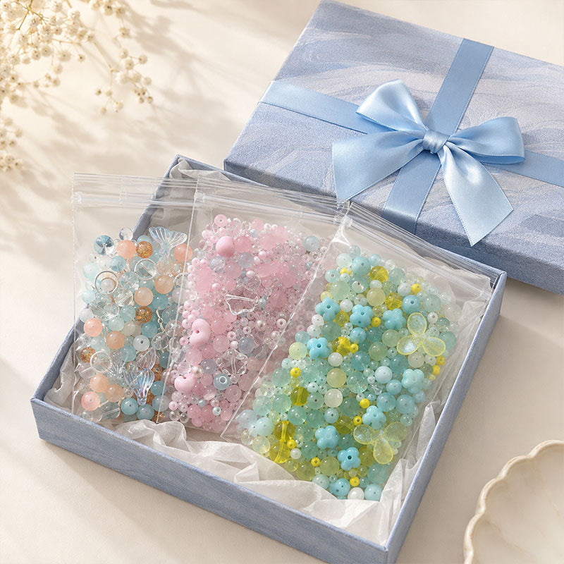 Three curated bead mix blind bags presented together in a gift-ready box